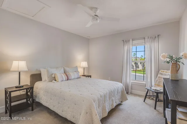 a bedroom with a bed and a lamp