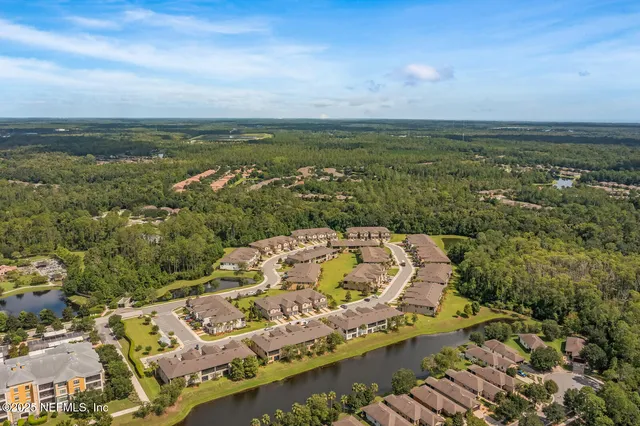 an aerial view of a city with ocean view