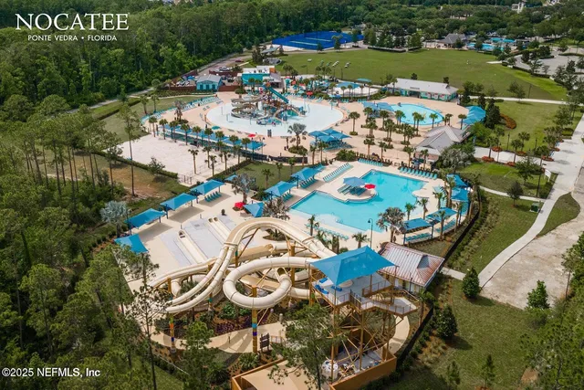 an aerial view of a house with a ocean view