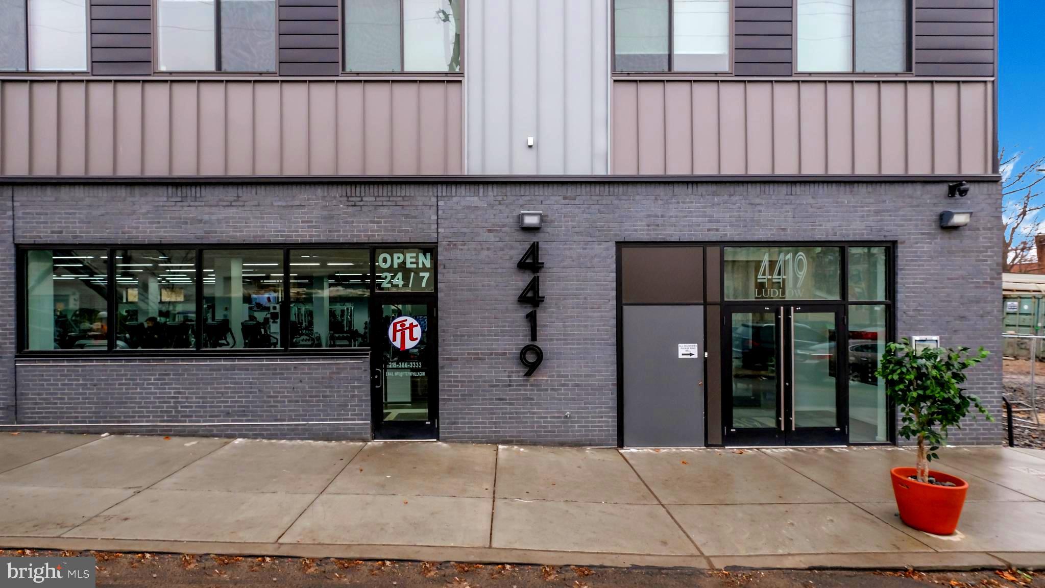 4419 Ludlow Street, Unit 206 Philadelphia, PA 19104 - Photo 2 of 12 a front view of a house with glass windows