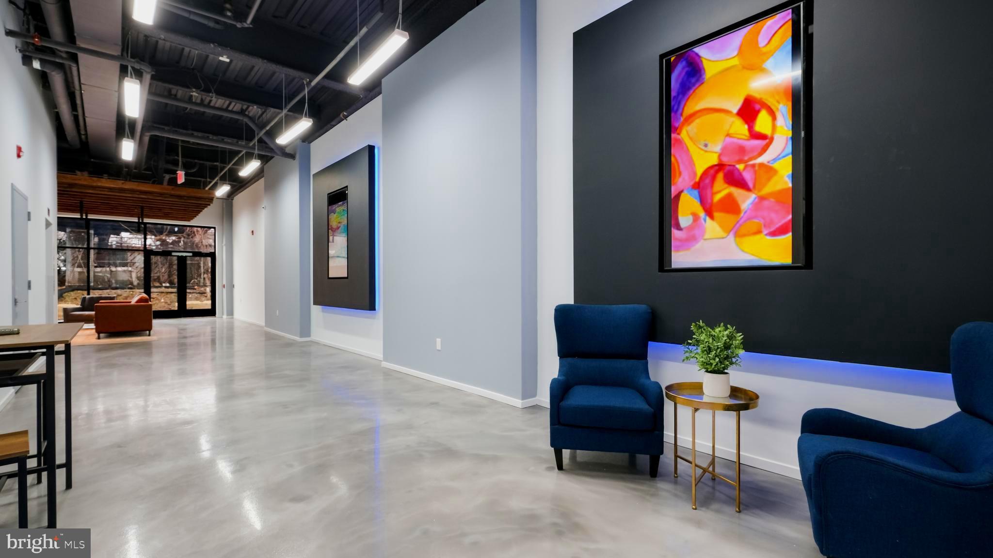 4419 Ludlow Street, Unit 206 Philadelphia, PA 19104 - Photo 3 of 12 a stairs and a couch in a room