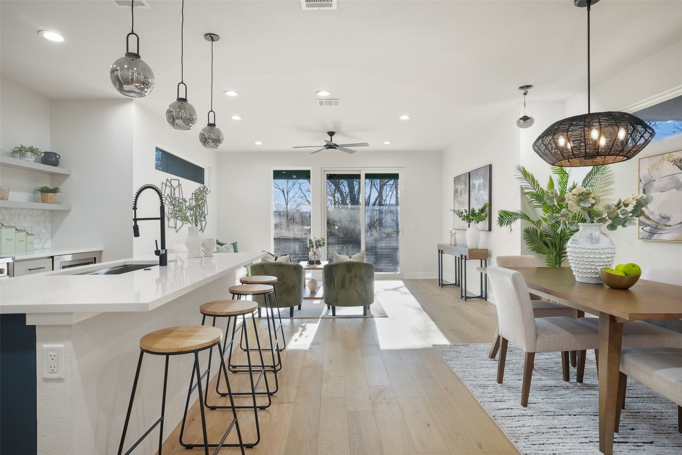5109 Stone Gate Drive, Unit 2 Austin, TX 78721 - Photo 10 of 23 Kitchen featuring hanging light fixtures, light wood-style floors, ceiling fan, open shelves, and recessed lighting