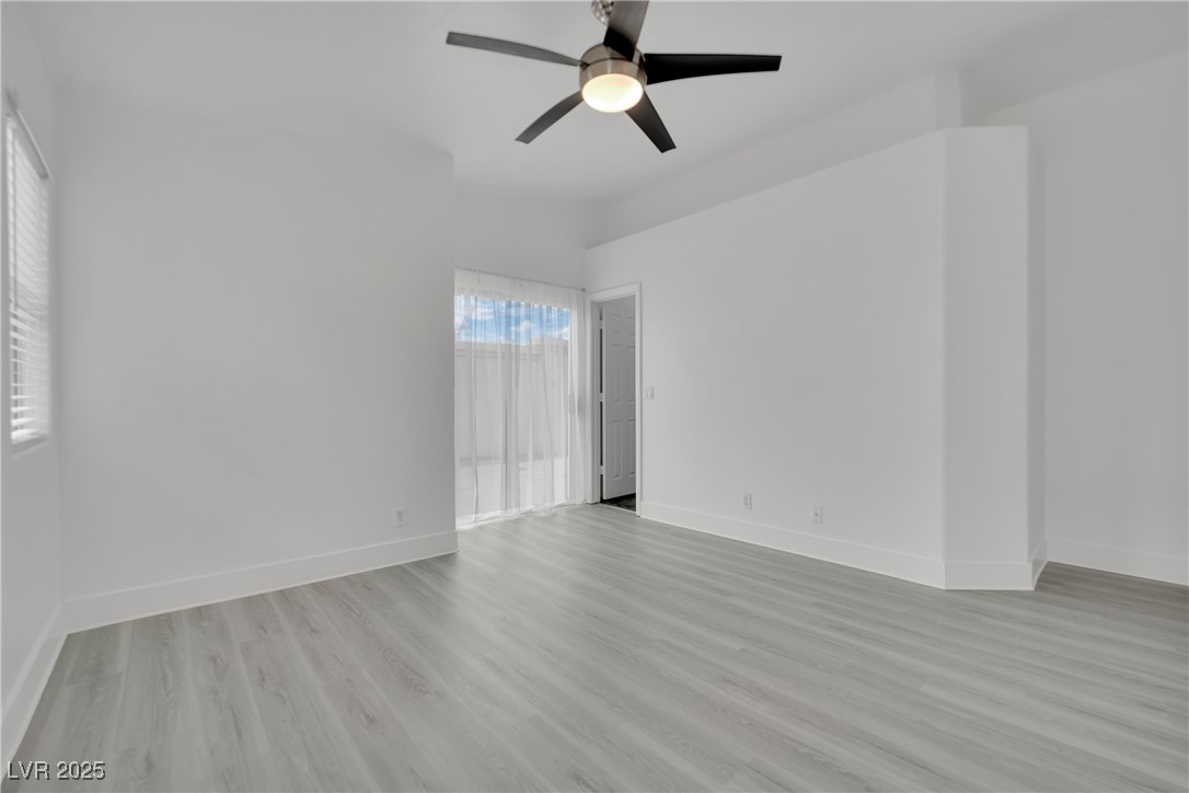 2218 Ramsgate Drive Henderson, NV 89074 - Photo 17 of 33 Spare room featuring light wood finished floors, a ceiling fan, and baseboards
