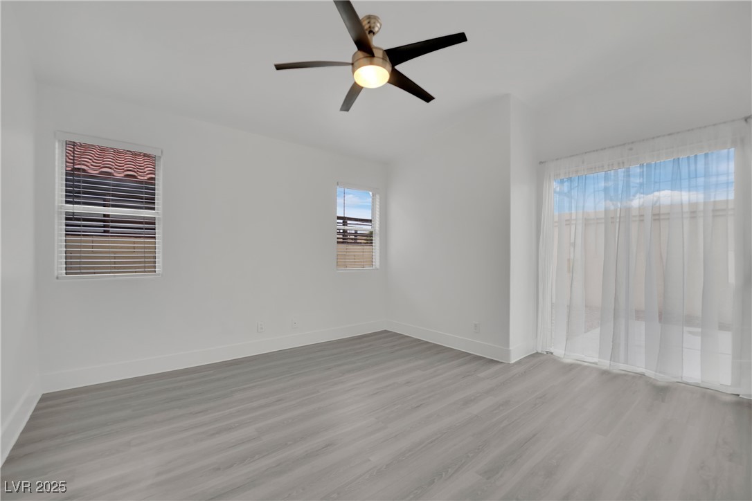 2218 Ramsgate Drive Henderson, NV 89074 - Photo 27 of 33 Spare room with light wood-style floors, baseboards, and a ceiling fan