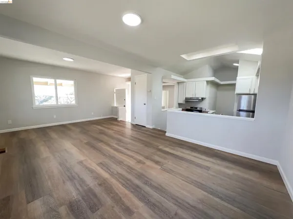 a view of a kitchen counter space and windows