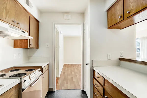 a kitchen with stainless steel appliances cabinets and a counter top space