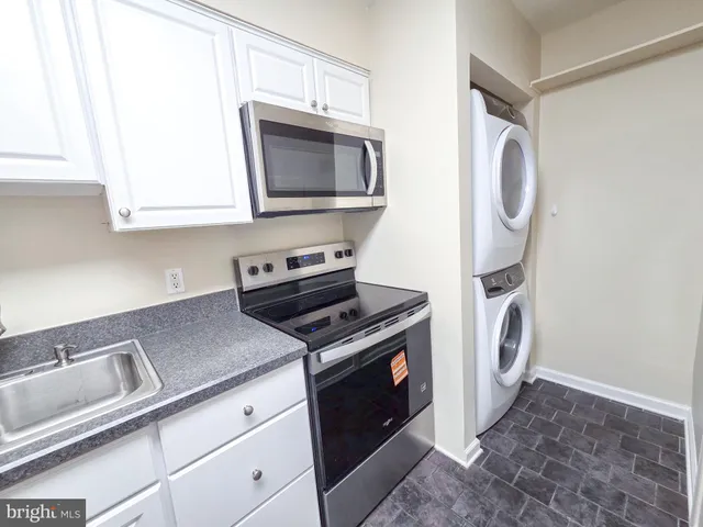 a kitchen with a stove and a microwave