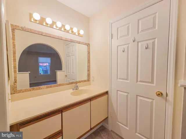 a bathroom with a sink a mirror and a shower