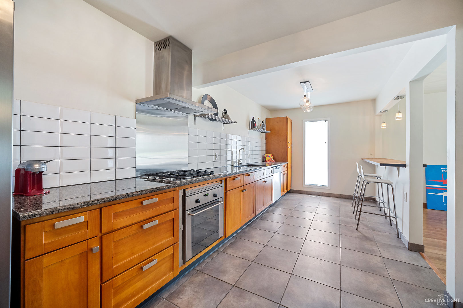 23 Aldon Road Montgomery, IL 60538 - Photo 12 of 31 a large kitchen with granite countertop a sink and cabinets