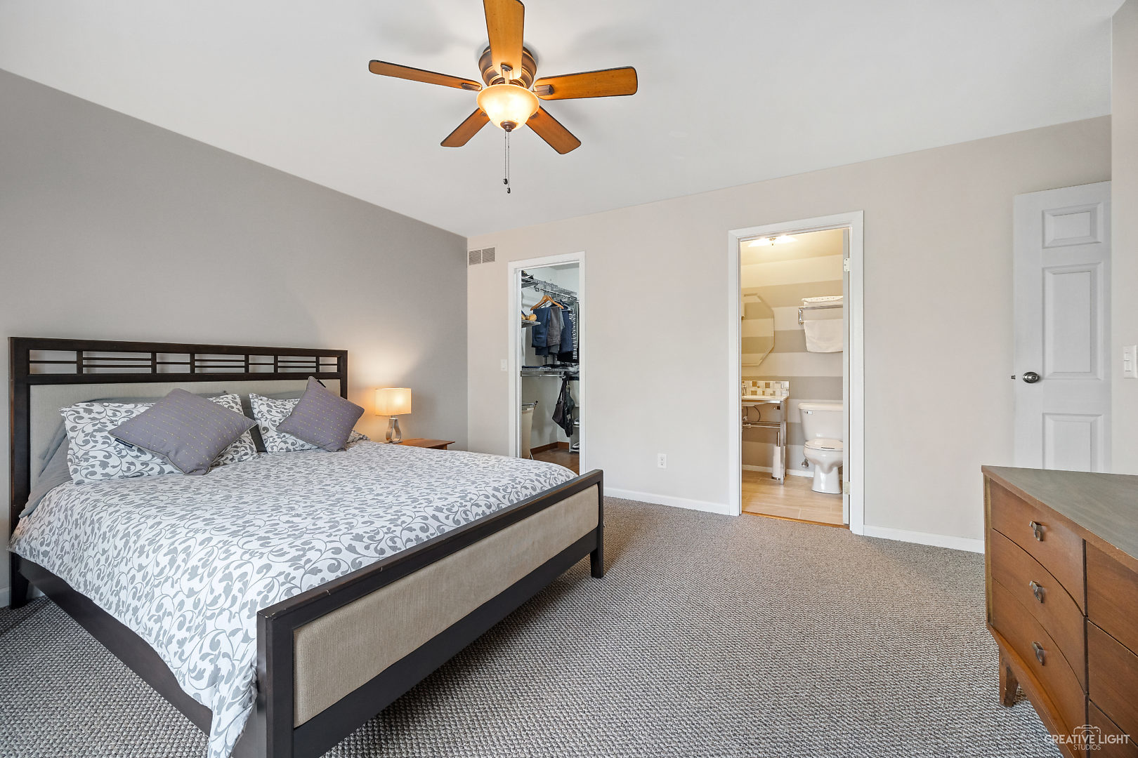 23 Aldon Road Montgomery, IL 60538 - Photo 19 of 31 a bedroom with a large bed and a chandelier