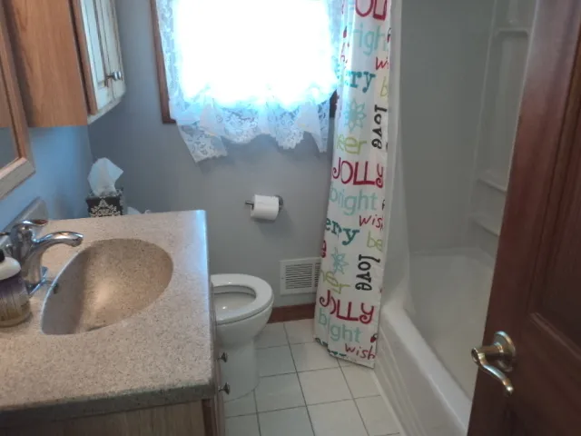 a bathroom with a toilet and a sink