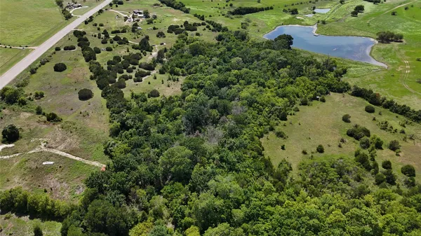 an aerial view of residential house with outdoor space