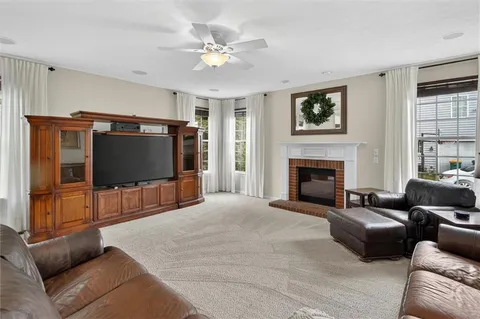 a large kitchen with a table and chairs