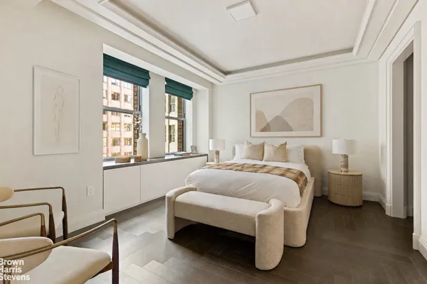 a spacious bedroom with a bed and window