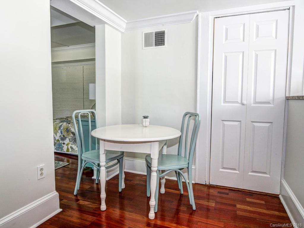 226 Providence Road Charlotte, NC 28207 - Photo 5 of 13 a view of a dining room with furniture wooden floor and a carpet