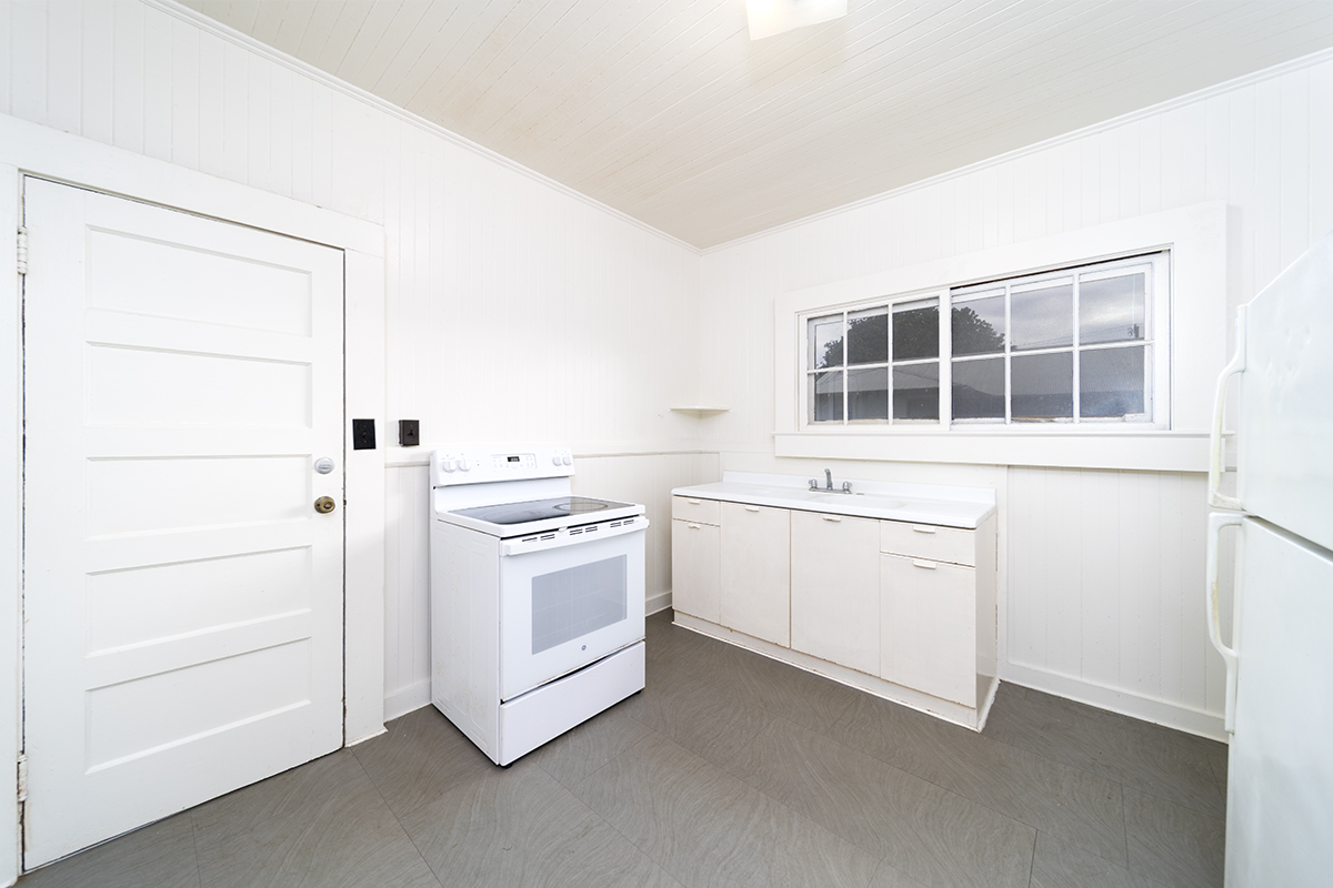 615 Kekuanaoa Street Hilo, HI 96720 - Photo 20 of 29 a kitchen with a stove and a microwave