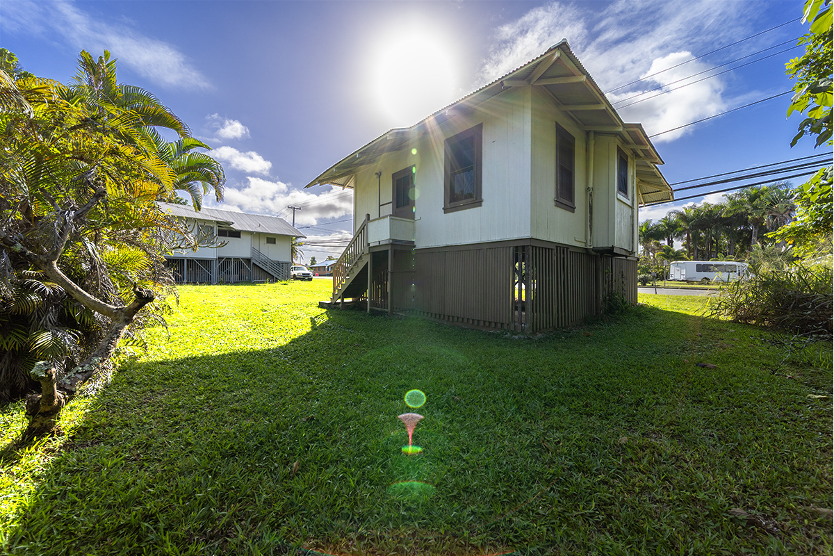 615 Kekuanaoa Street Hilo, HI 96720 - Photo 7 of 29 a view of an house with backyard and a swimming pool