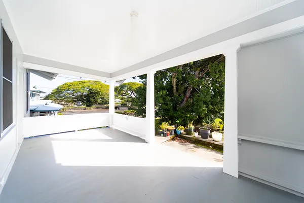 a view of an empty room with a large window