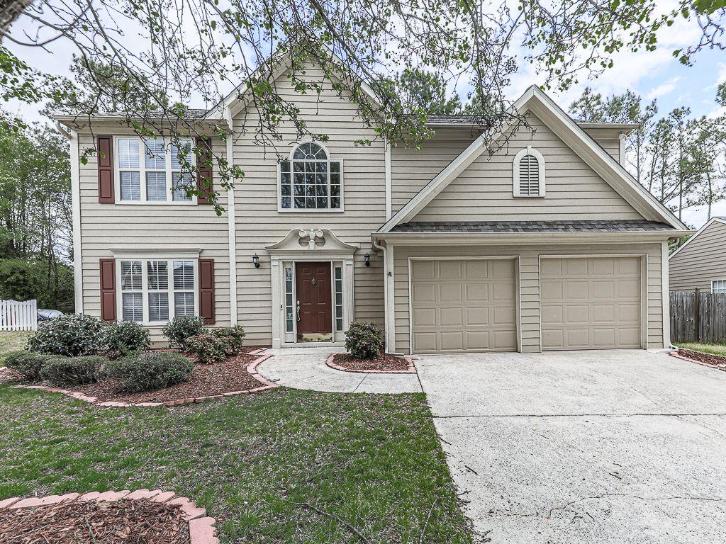 3178 Bellestone Court Marietta, GA 30066 - Photo 1 of 1 a front view of a house with yard and parking
