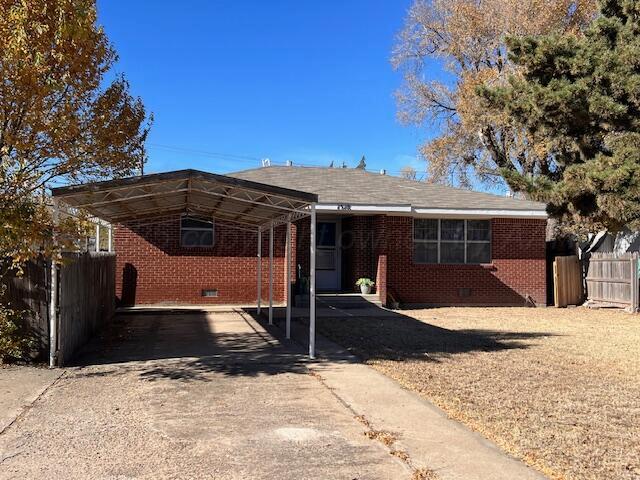 a view of a house with a yard covered in snow