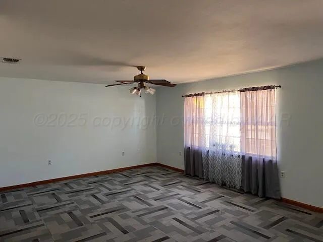 a view of an empty room and window