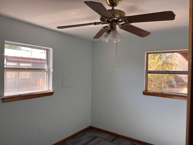 1518 South Drake Street Perryton, TX 79070 - Photo 7 of 13 an empty room with a window