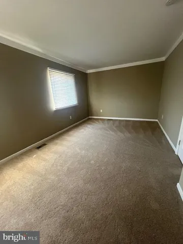 an empty room with a empty space and window