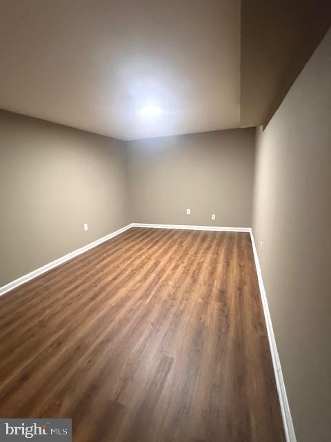 16 Brian Court, Unit 245 Gaithersburg, MD 20877 - Photo 20 of 22 en empty room with wooden floor and windows