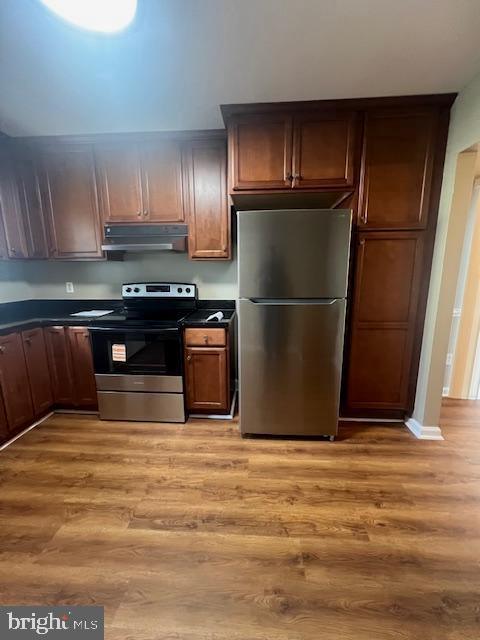16 Brian Court, Unit 245 Gaithersburg, MD 20877 - Photo 6 of 22 a kitchen with granite countertop stainless steel appliances and wooden cabinets