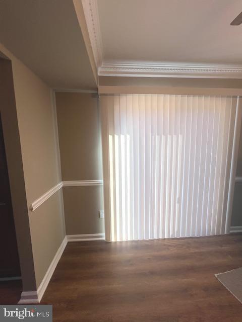 16 Brian Court, Unit 245 Gaithersburg, MD 20877 - Photo 8 of 22 a view of an empty room with wooden floor and a window