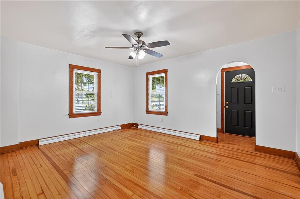 1605 Maratta Road Aliquippa, PA 15001 - Photo 11 of 34 a view of an empty room with window and wooden floor
