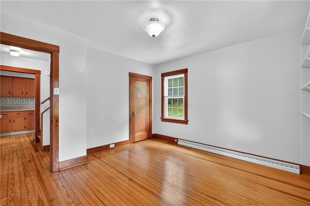 1605 Maratta Road Aliquippa, PA 15001 - Photo 12 of 34 an empty room with wooden floor and windows