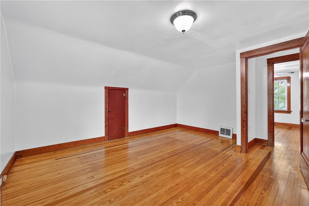 1605 Maratta Road Aliquippa, PA 15001 - Photo 18 of 34 a view of an empty room with wooden floor and a window