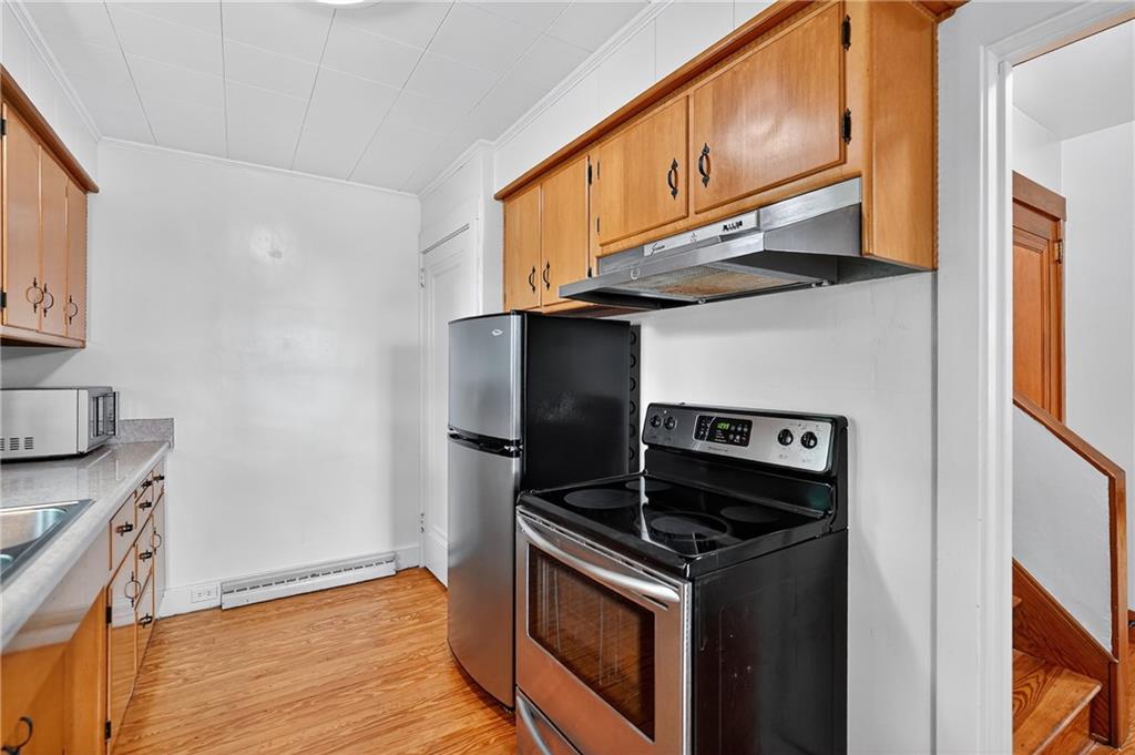 1605 Maratta Road Aliquippa, PA 15001 - Photo 22 of 34 a kitchen with stainless steel appliances granite countertop a stove and a refrigerator