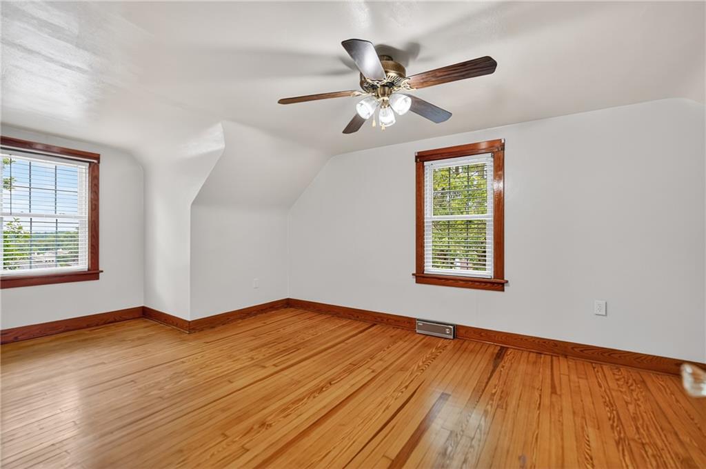 1605 Maratta Road Aliquippa, PA 15001 - Photo 23 of 34 a view of an empty room with wooden floor and a window