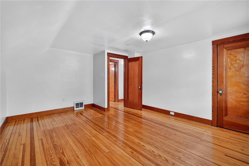 1605 Maratta Road Aliquippa, PA 15001 - Photo 24 of 34 a view of an empty room with wooden floor and a window