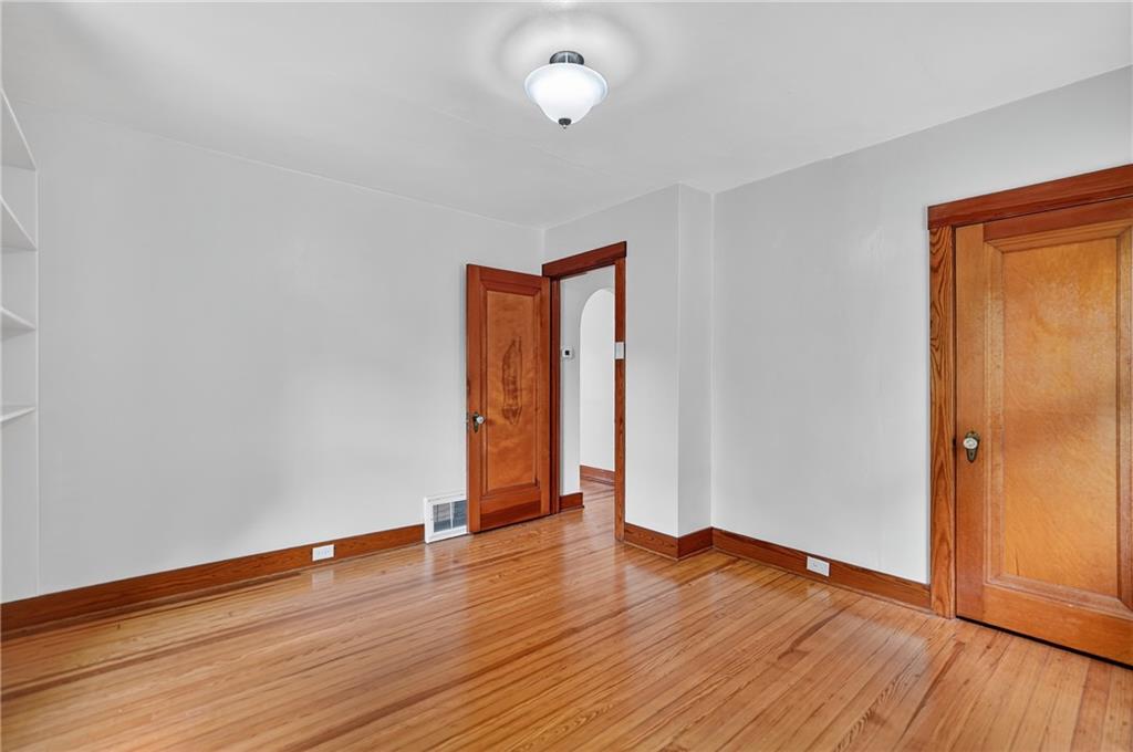 1605 Maratta Road Aliquippa, PA 15001 - Photo 25 of 34 a view of an empty room with wooden floor and a window