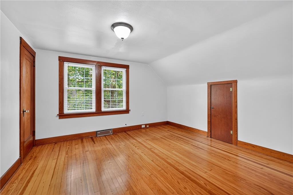 1605 Maratta Road Aliquippa, PA 15001 - Photo 26 of 34 an empty room with wooden floor and windows