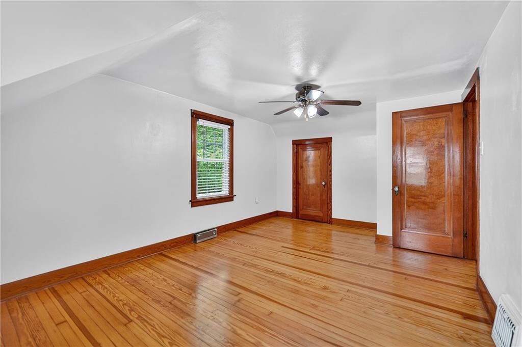 1605 Maratta Road Aliquippa, PA 15001 - Photo 27 of 34 a view of an empty room with window and wooden floor