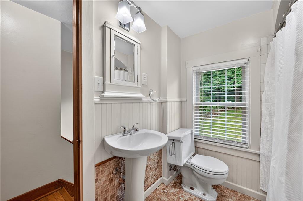 1605 Maratta Road Aliquippa, PA 15001 - Photo 29 of 34 a bathroom with a sink toilet and a mirror
