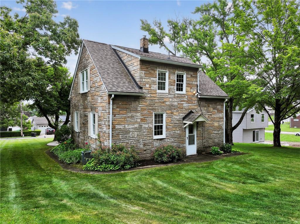 1605 Maratta Road Aliquippa, PA 15001 - Photo 6 of 34 a front view of house with a garden