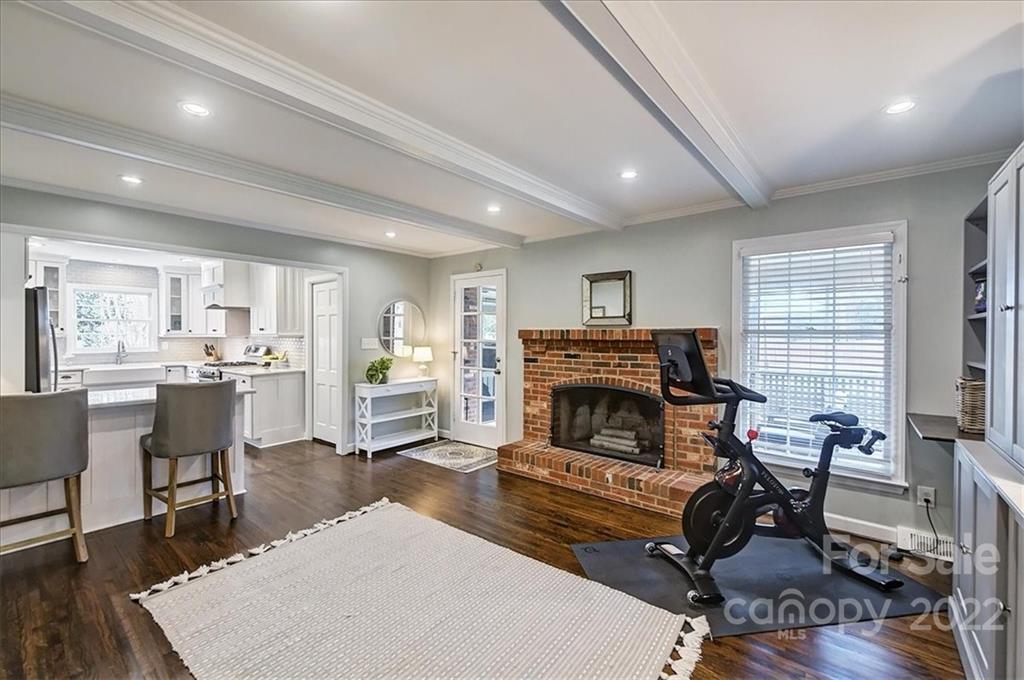 3021 Eastburn Road Charlotte, NC 28210 - Photo 13 of 48 a living room with furniture a fireplace and a flat screen tv