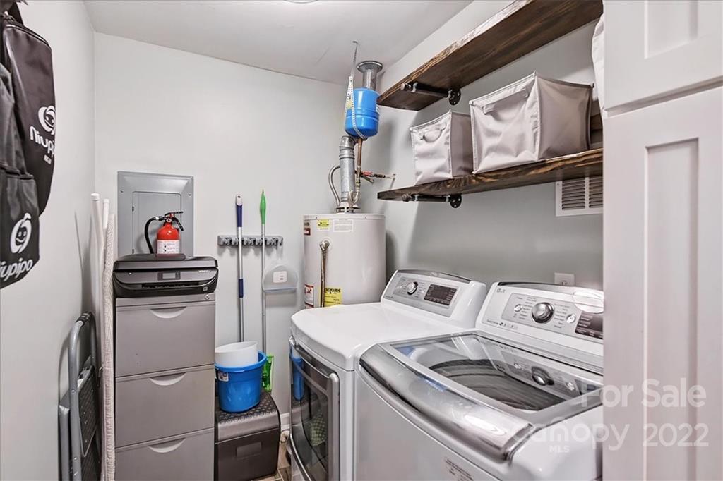 3021 Eastburn Road Charlotte, NC 28210 - Photo 25 of 48 a utility room with dryer washer and a view of living room