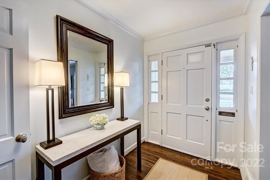 3021 Eastburn Road Charlotte, NC 28210 - Photo 3 of 48 a bathroom with a sink a light fixture and a mirror