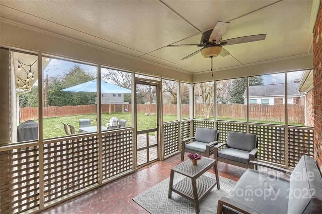 3021 Eastburn Road Charlotte, NC 28210 - Photo 36 of 48 a living room with furniture and a floor to ceiling window