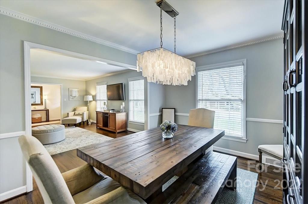 3021 Eastburn Road Charlotte, NC 28210 - Photo 10 of 48 a dining room with furniture a chandelier and window