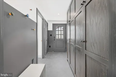 a view of a hallway with a white walls