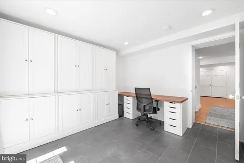 a white toilet sitting next to a shower
