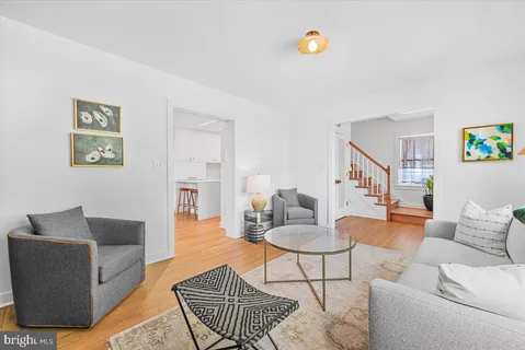 a living room with furniture and a rug
