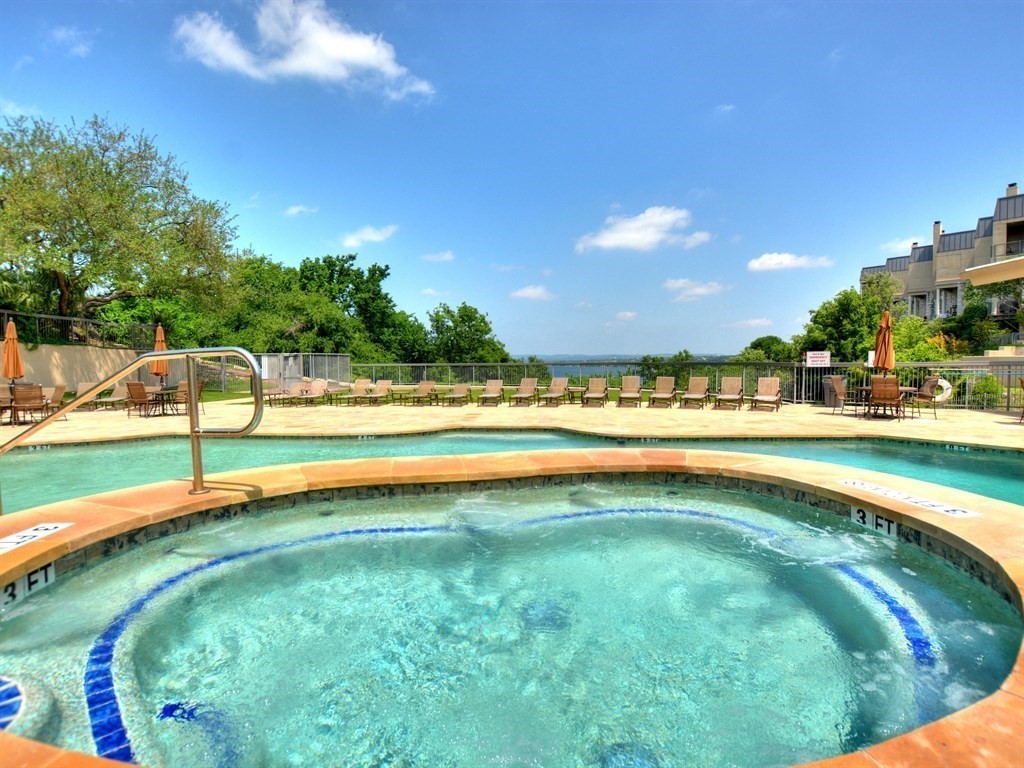 2918 Ranch Road 620 North, Unit X205 Austin, TX 78734 - Photo 21 of 23 a view of an outdoor space and swimming pool